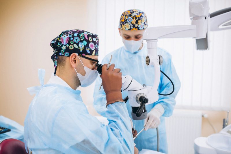 Dentist with patient at a visit